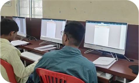 Students practicing accounting software on desktop computers during training session